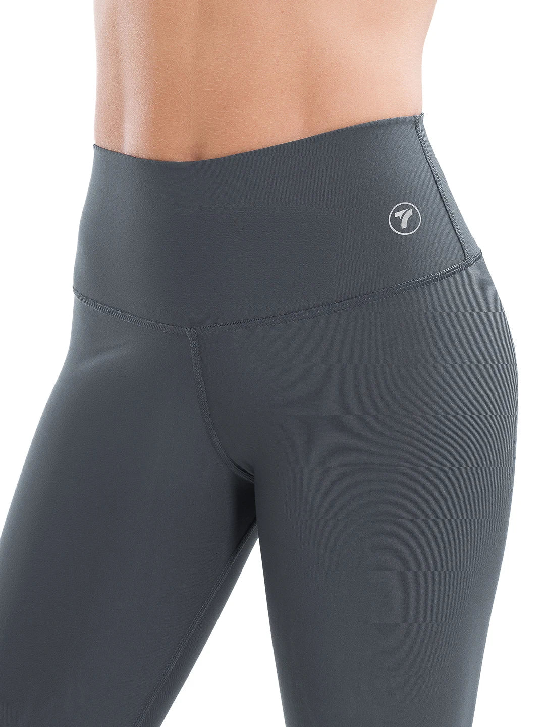 Detalle tejido elástico legging deportivo gris oscuro tiro alto TENFIT