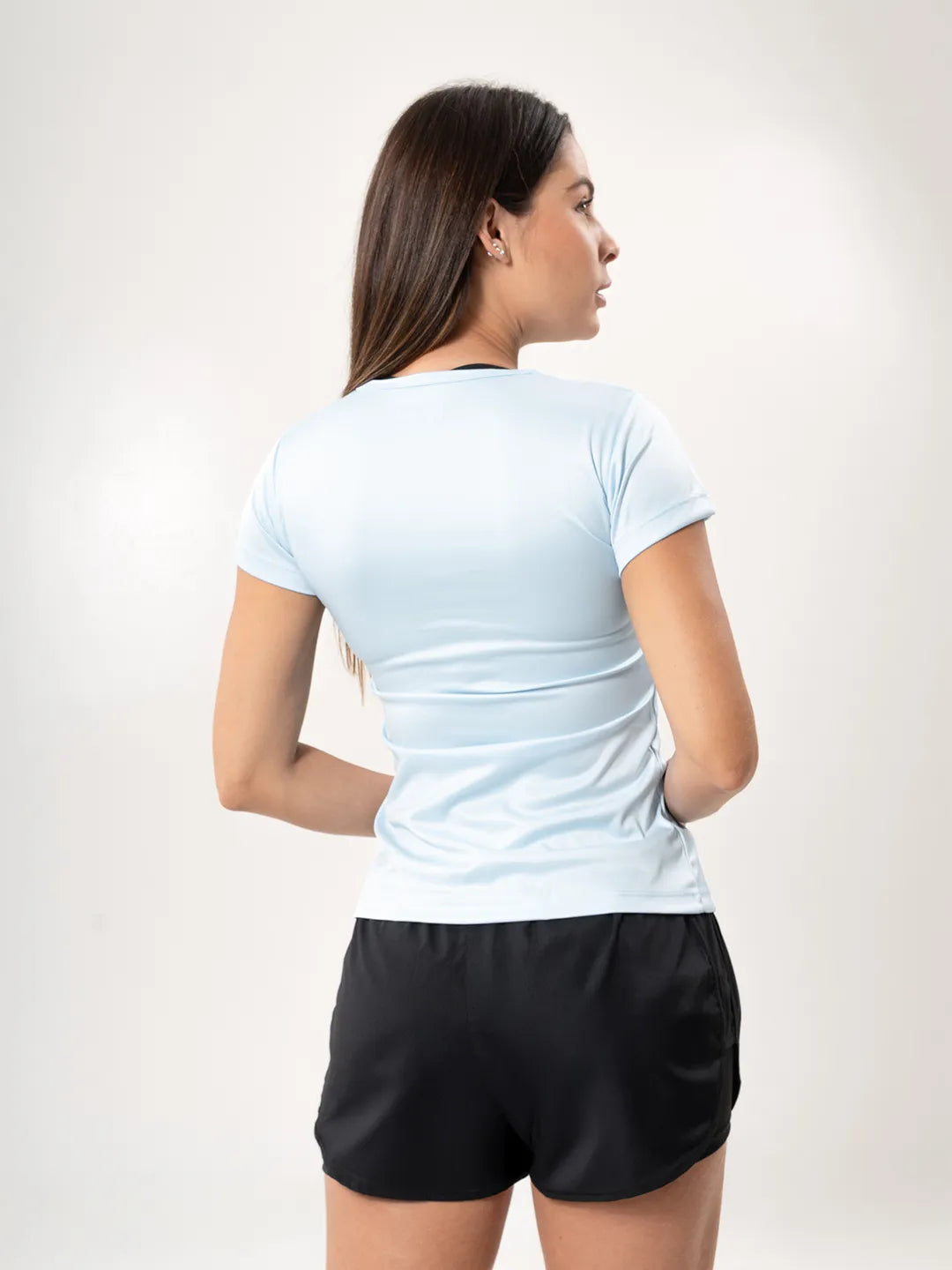 Camiseta deportiva azul celeste mujer posterior media distancia TENFIT
