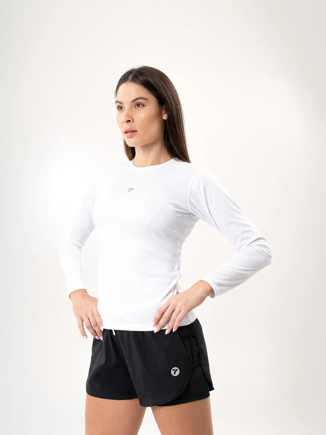 Buzo compresión mujer blanco TENFIT vista lateral — ajuste ceñido