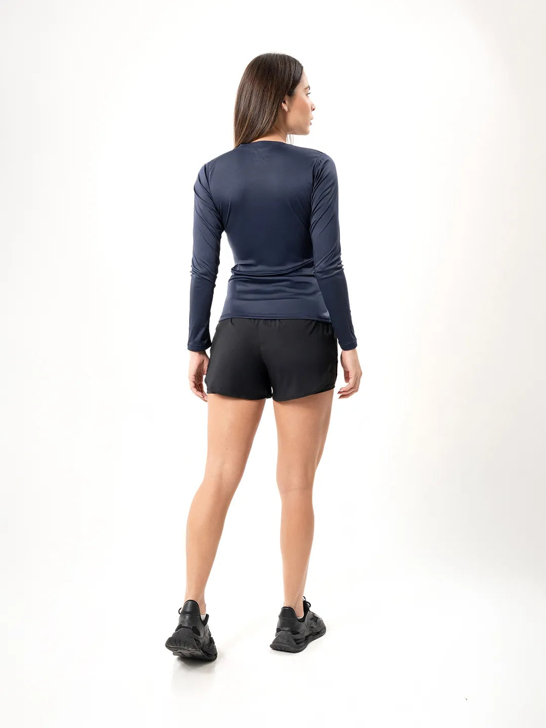 Buzo compresión azul turquí TENFIT espalda — sin transparencias