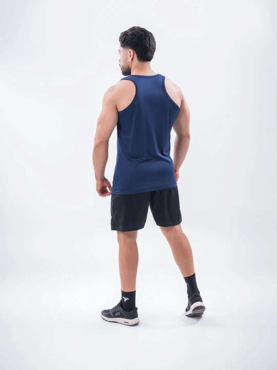 Vista espalda tank top azul turquí hombre TENFIT Colombia