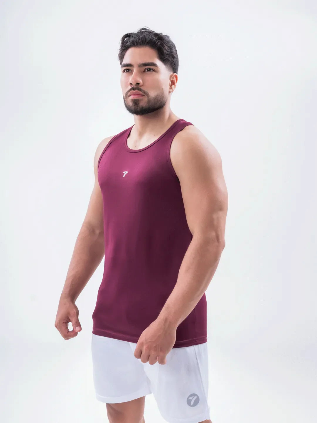 Tank top hombre vinotinto UV 30 secado rápido TENFIT Colombia