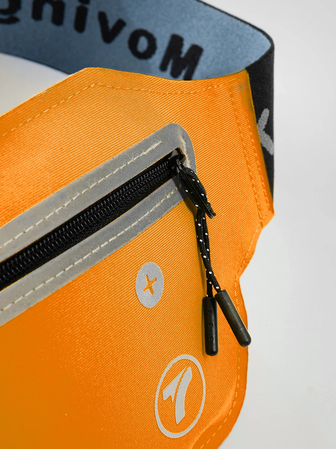 Detalle bolsillos canguro deportivo naranja running gym TENFIT Colombia
