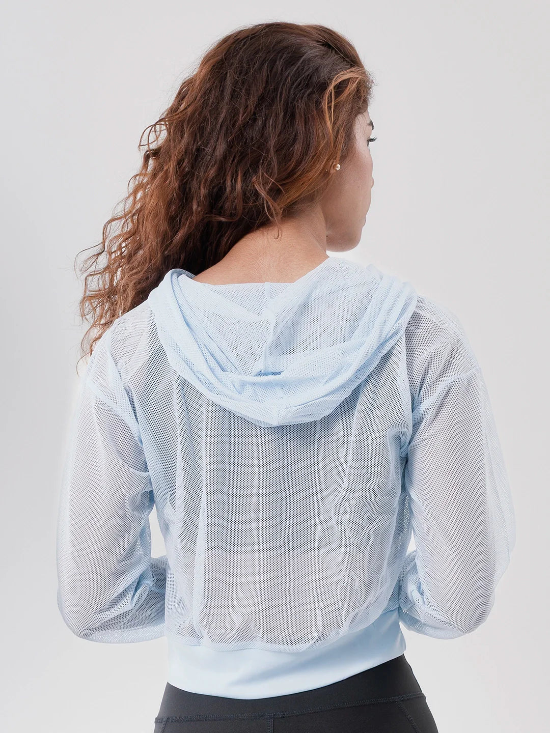 Buzo hoodie deportivo mujer azul celeste TENFIT - vista posterior