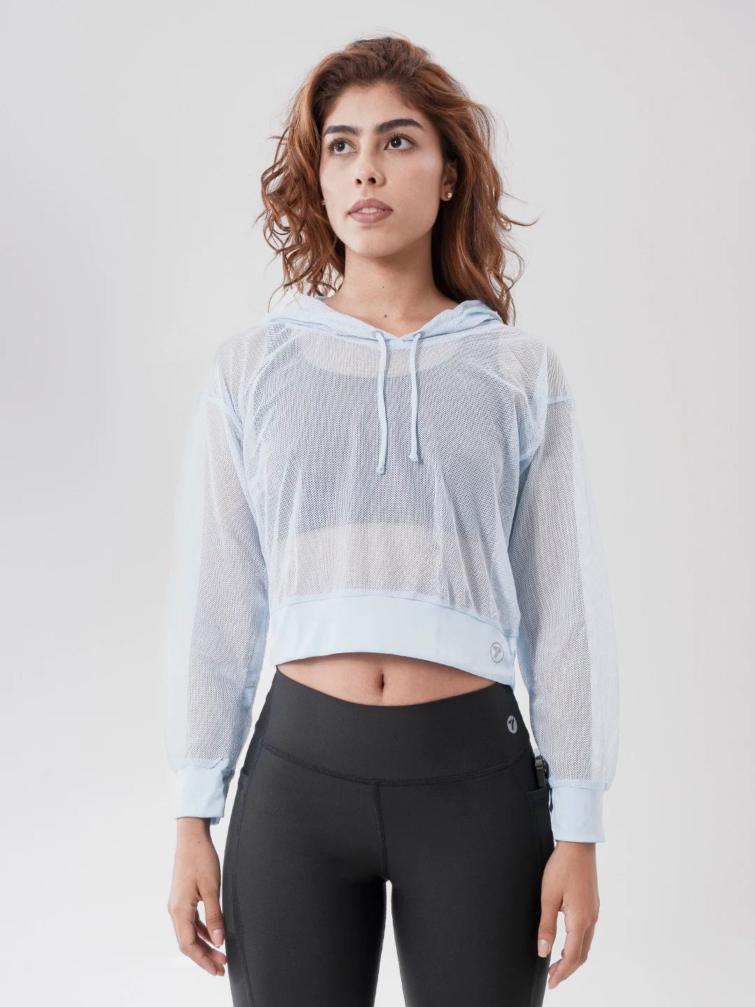 Buzo deportivo mujer azul celeste malla con capota TENFIT - vista frontal