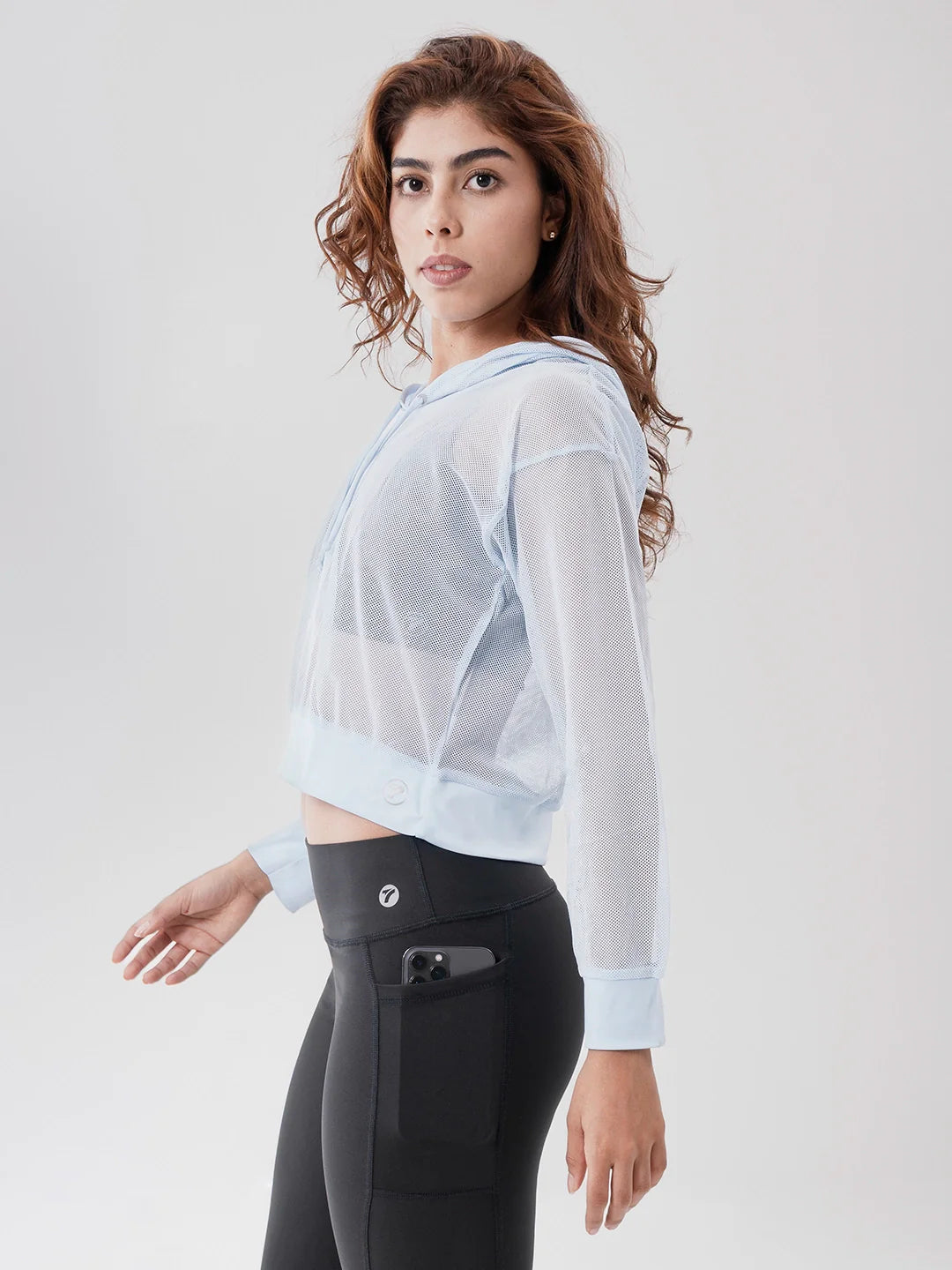 Buzo deportivo mujer azul celeste malla con capota TENFIT - vista frontal