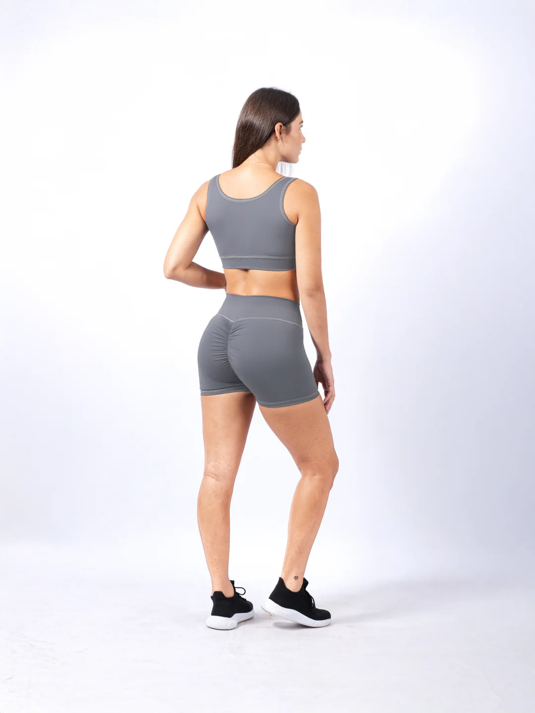 Top deportivo unicolor gris claro secado rápido TENFIT - vista trasera