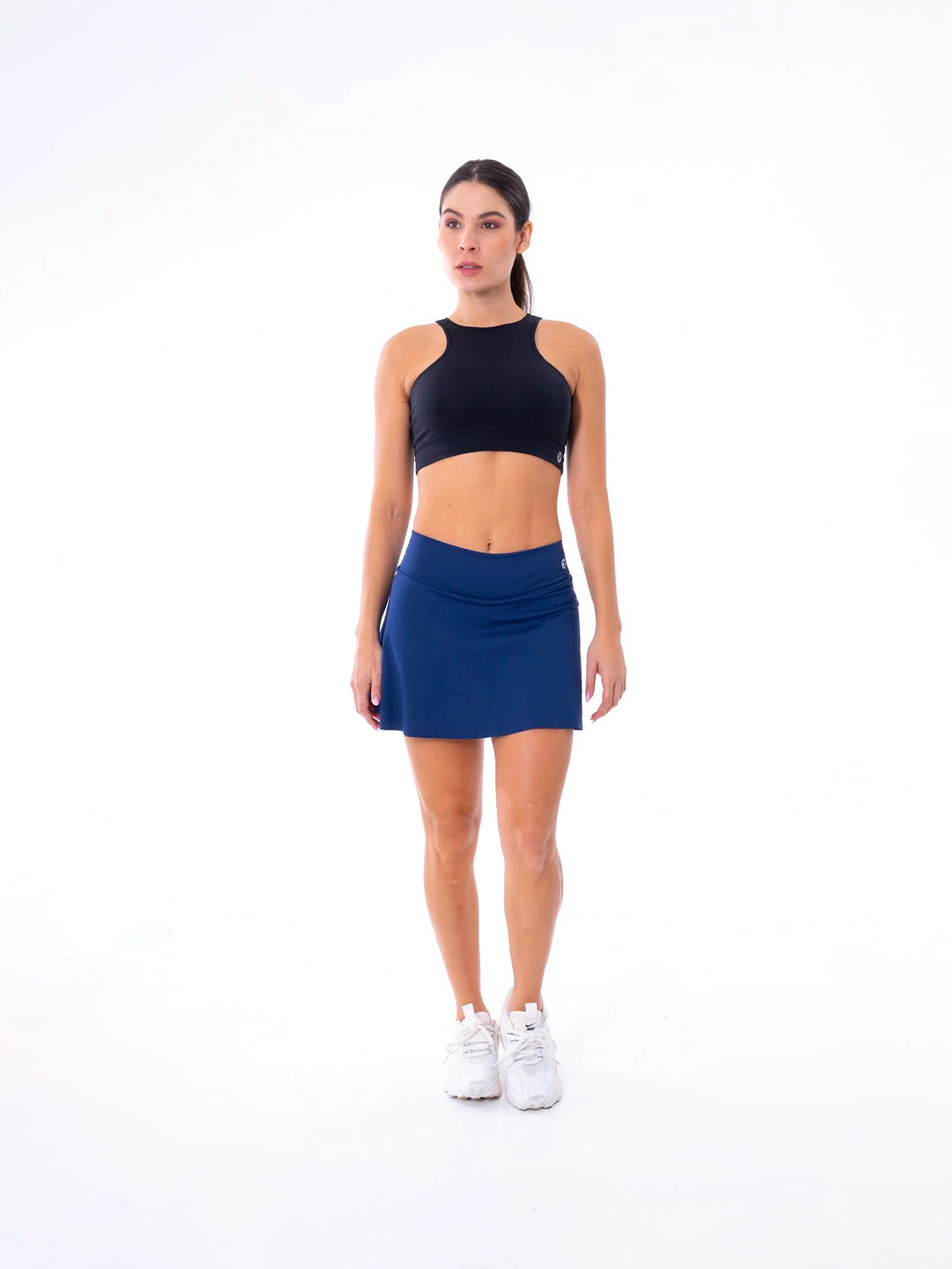 Falda corta azul turquí con short interior para tenis y gym mujer