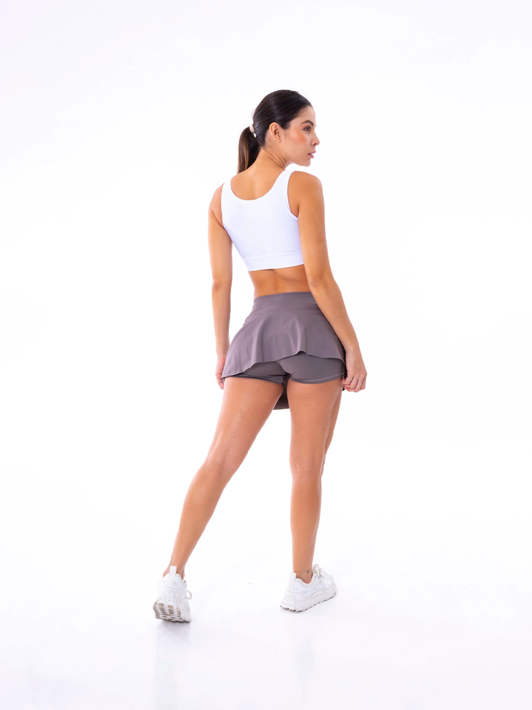Detalle biker integrado falda caqui deportiva mujer TENFIT
