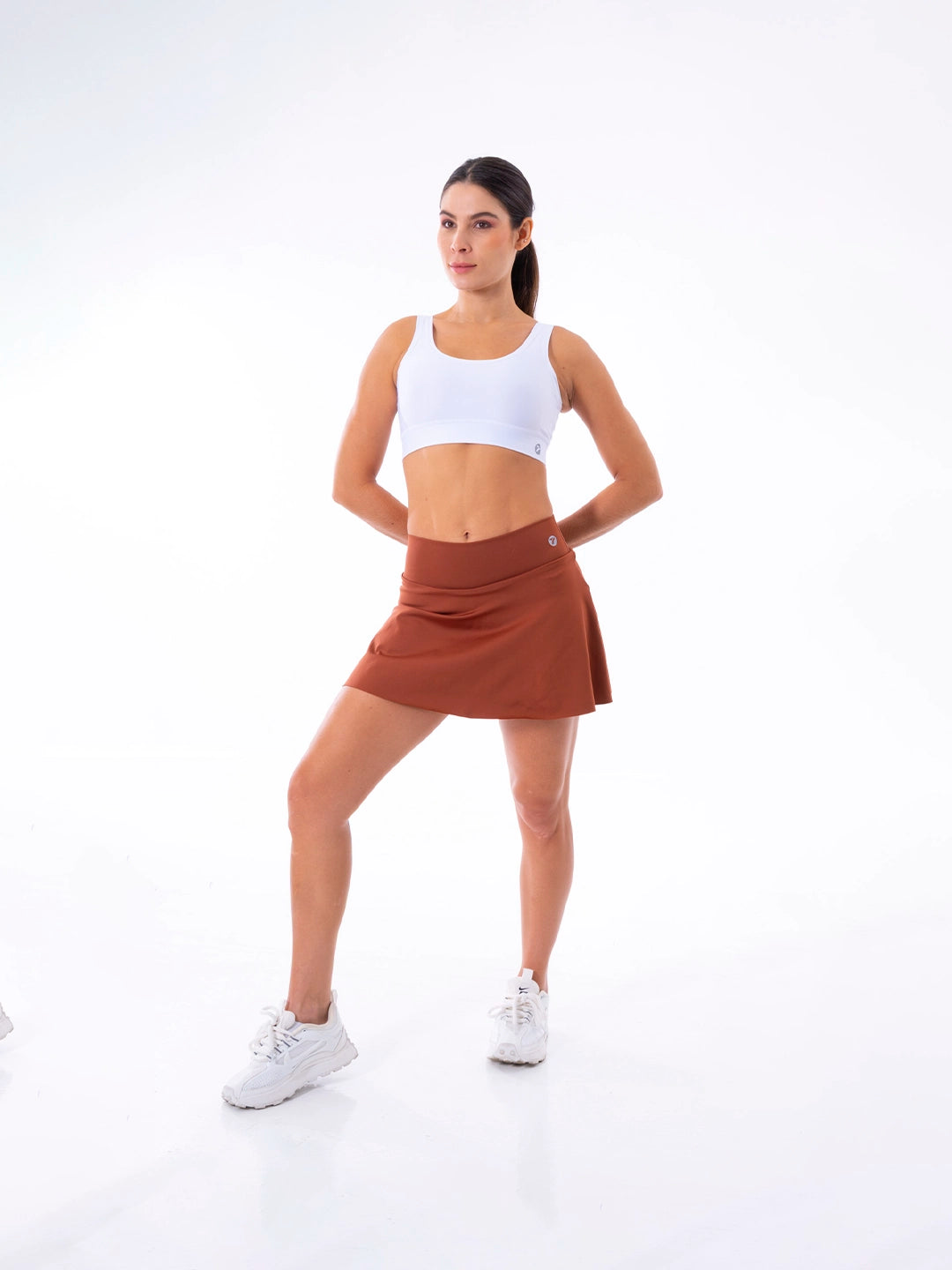 Falda corta terracota con short interior tenis gym mujer Colombia