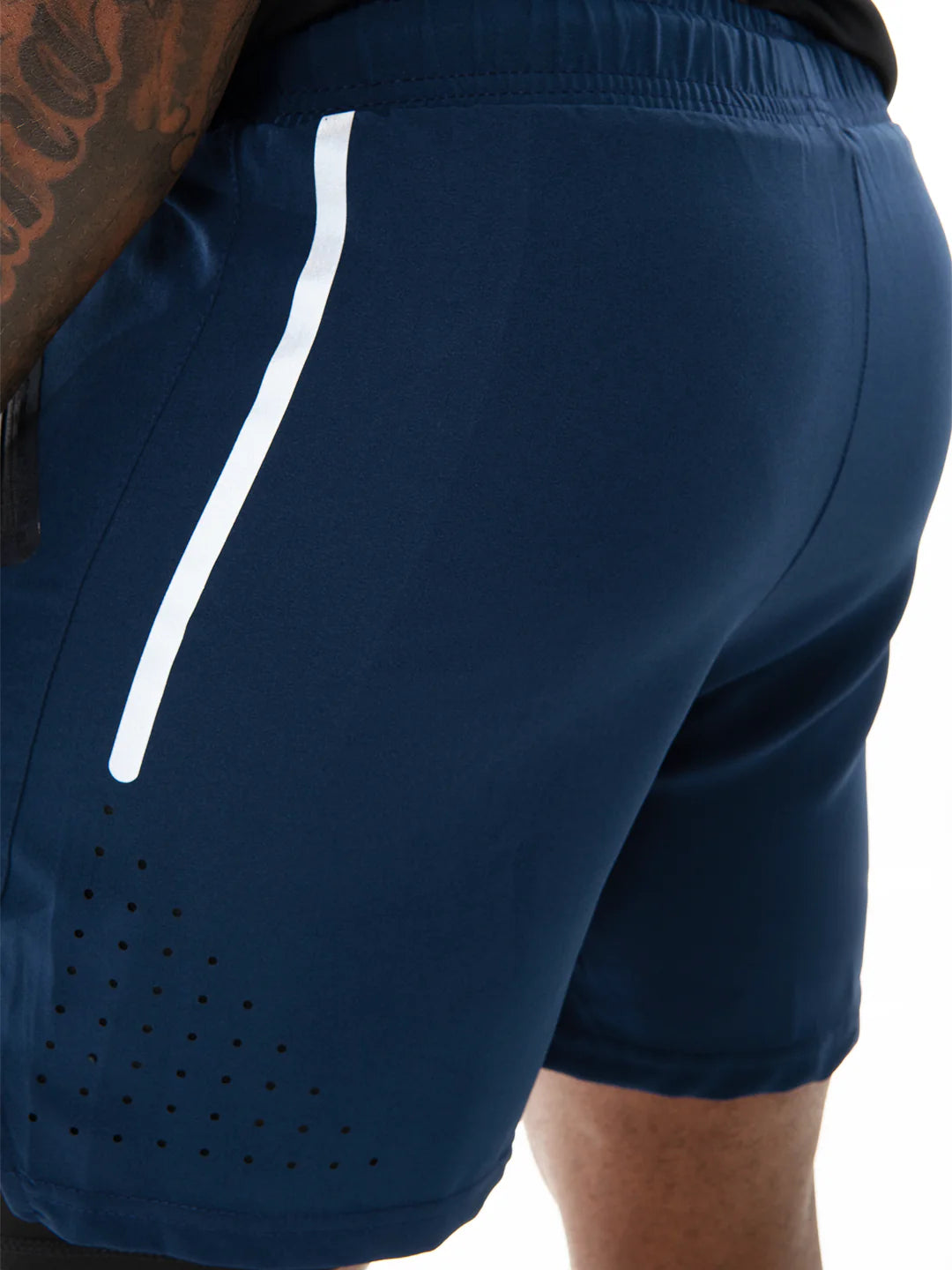 Pantaloneta Track Azul Turquí detalle corte hombre – TENFIT