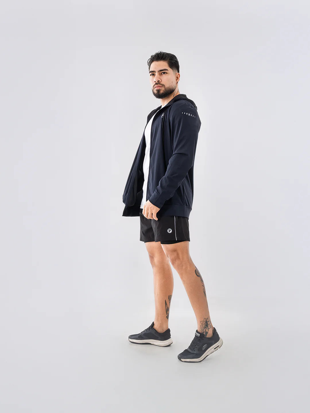 Corte ergonómico chaqueta deportiva azul turquí TENFIT Velox hombre