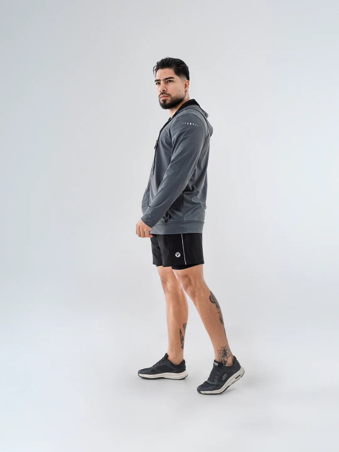 Chaqueta deportiva gris oscuro TENFIT Velox - corte ergonómico hombre