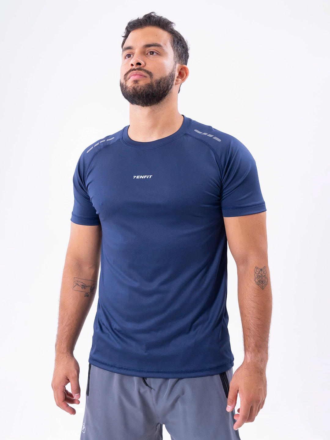 Camiseta deportiva azul turquí regular fit hombre TENFIT - vista frontal