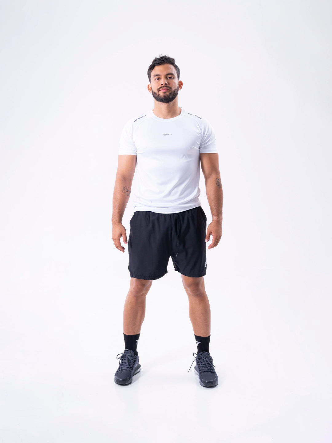 Camiseta deportiva blanca regular fit hombre TENFIT — vista frontal