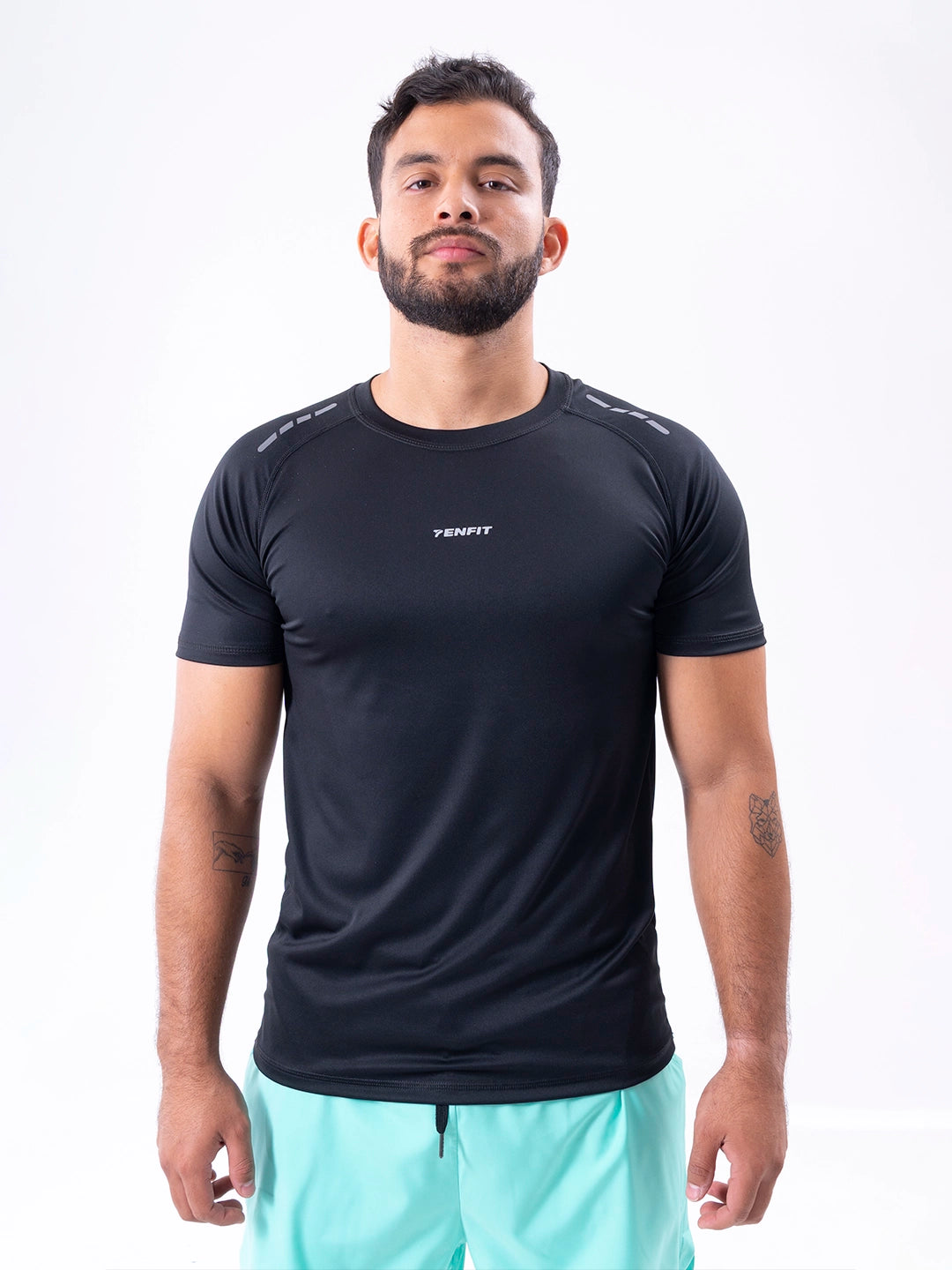 Camiseta deportiva negra regular fit hombre TENFIT - vista frontal