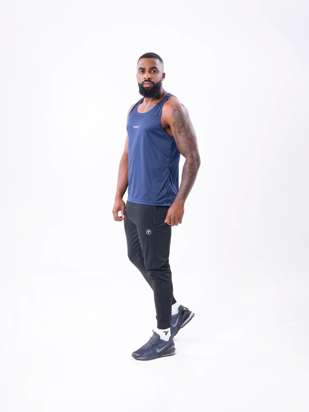 Camisilla Velocity azul turquí espalda hombre entrenamiento TENFIT