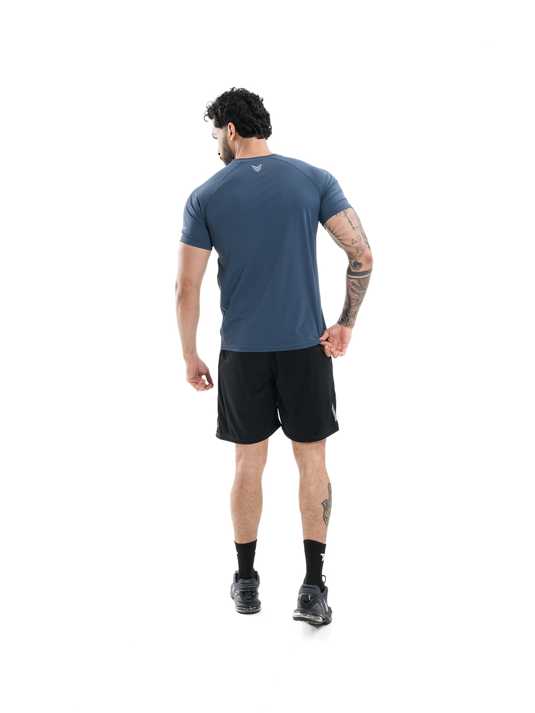 Camiseta transpirable azul índigo hombre TENFIT - vista trasera