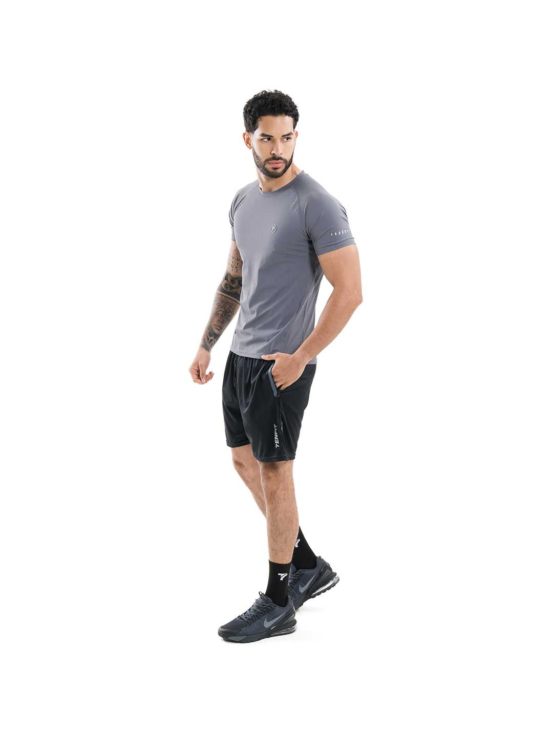 Camiseta transpirable gris oscuro hombre TENFIT - vista lateral