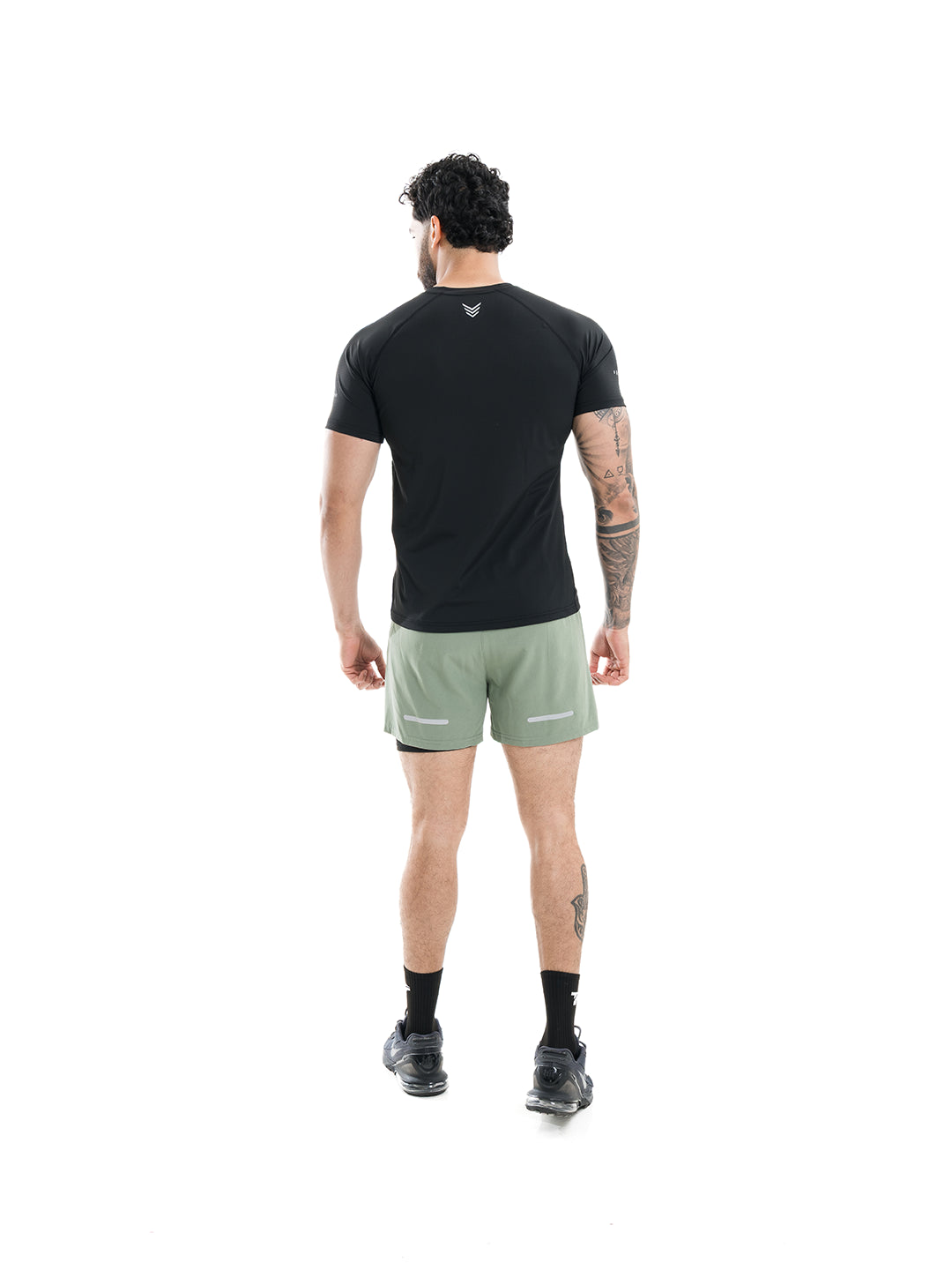 Camiseta deportiva negra hombre TENFIT - vista trasera transpirable