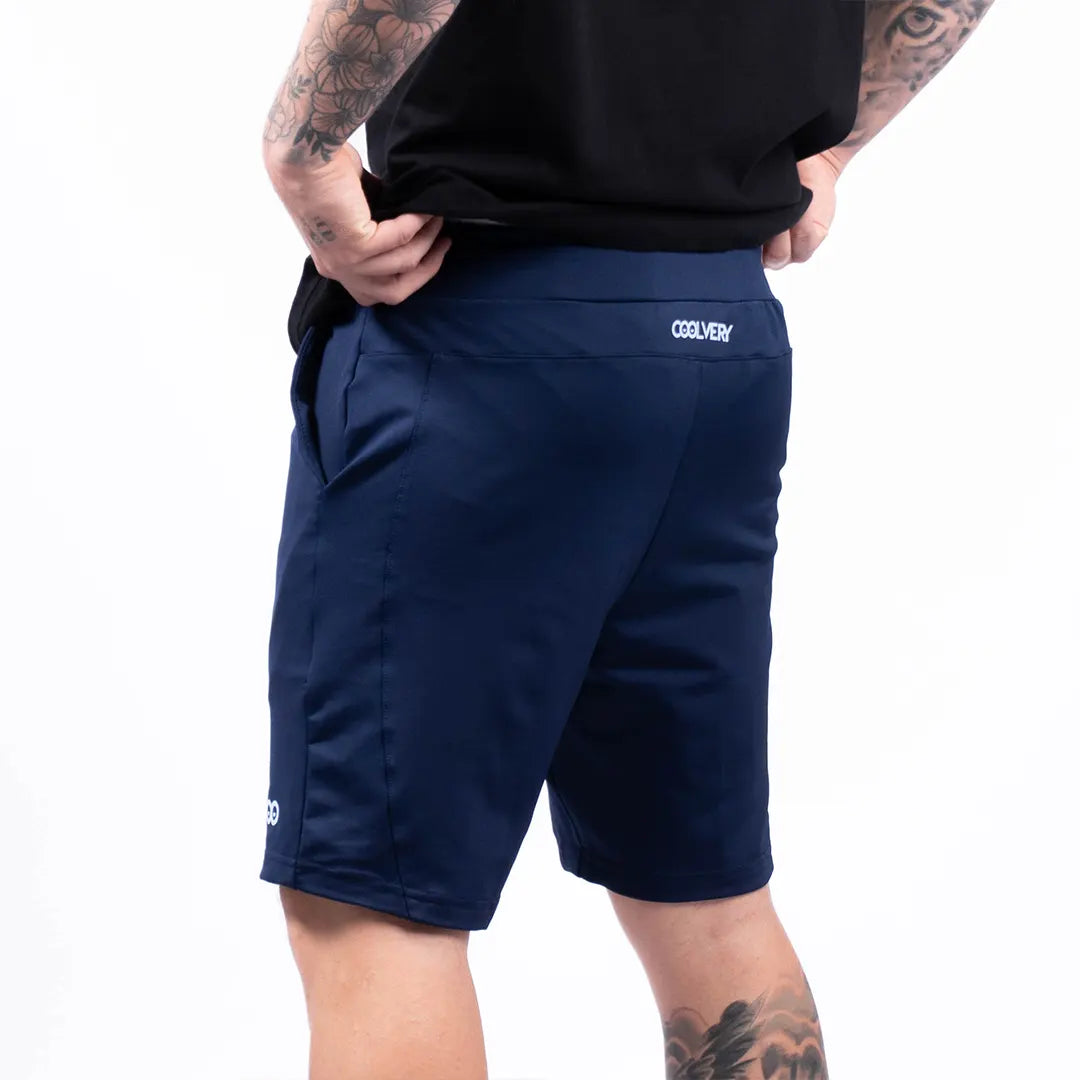 Pantaloneta azul turquí hombre TENFIT detalle bolsillo