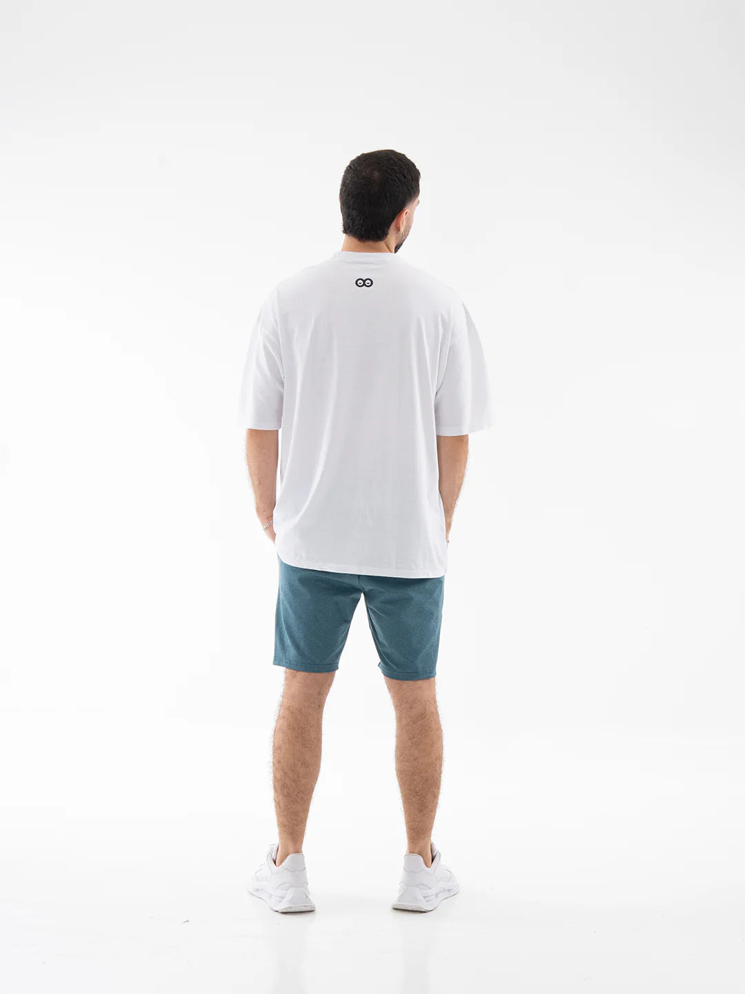Pantaloneta verde petróleo jaspe hombre TENFIT vista atrás