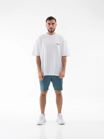 Pantaloneta urbana verde petróleo jaspe hombre TENFIT frente
