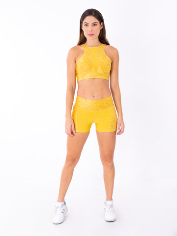 Short deportivo mostaza mujer TENFIT - vista frontal