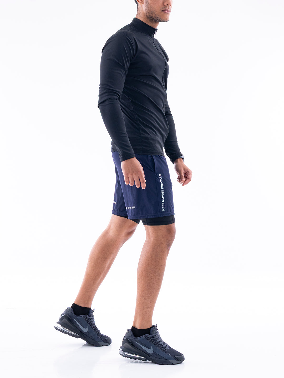 Pantaloneta deportiva azul turquí hombre TENFIT lado